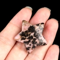 Handcrafted pink and black rhodonite natural crystal stone in polished 30mm star shape - Rhodonite