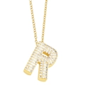 Macro shot of gold-plated letter R pendant encrusted with sparkling white cubic zirconia - Gold-R