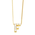 Detailed close-up of gold letter F pendant featuring baguette-cut sparkling zircon stones - Gold F
