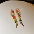 Macro shot of gold-plated parrot earrings featuring colorful enamel and inlaid zircons - Silver Pin-Colorful Parrot (Real Gold Plated) / Colorful