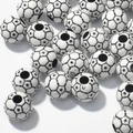 Detailed view of black and white football shaped acrylic beads with star patterns for jewelry - 12mm Football White Background Black Line