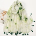 Detail of white cotton linen scarf featuring green tie-dye patterns and dark green tassels - White Green Tie Dye Style (XS018-03)