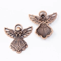 Macro view of vintage bronze angel charms showing detailed front and back textures - Antique Red Copper