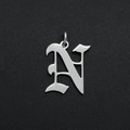 Close-up of a silver Gothic letter N pendant crafted from polished stainless steel - Letter N