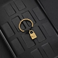 Elastic beaded ring with gold metal spheres, black faceted beads and star lock pendant - Black Bead Lock Style (F-R584)