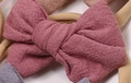 Pink soft nylon baby headband with fabric bow detail from a 10-piece variety set - Light Purple-Red