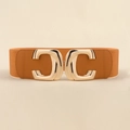 Close-up of golden double C buckle on a brown wide elastic waist belt for women - Camel