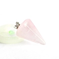 Natural rose quartz faceted cone pendant with silver metal clasp on crystal display base - Rose Quartz