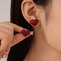 Fashionable dark red heart-shaped velvet earrings on a model showing elegant style - Red Fabric Heart Stud Earrings (925 Sterling Silver Earring Post)