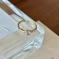 Adjustable golden butterfly ring with irregular texture and sparkling round gemstone - Irregular Lava
