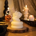 Detail of white snake and rose sculpted scented candle on a rustic wood base - Snake with Flower (White)