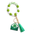 Detail of St. Patrick's Day keychain with green beads, shamrock charm, and tassel - US 2