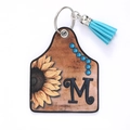 Brown leather sunflower keychain with blue tassel and artistic letter M charm - Letter M