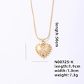 Gold heart pendant necklace featuring crystal letter K on a sleek snake chain - Letter K