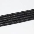 Macro shot of natural black volcanic lava stone spacer beads for DIY jewelry making - 3x6mm (110pcs) / Lava Stone