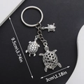 Silver zinc alloy turtle keychain with two sea turtles showing 9.5cm length dimensions - Ancient Silver Turtle Keychain-ER650