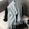Close-up of soft light blue scarf featuring classic fringed edges and cashmere texture - Light Blue