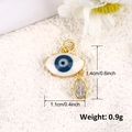 Macro view of gold plated evil eye pendant with white enamel and teardrop zircon detail - A0270-Teardrop Evil Eye