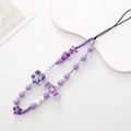Detail of purple beaded phone strap with candy and star shapes on white tray - Purple Candy (K1059)