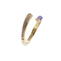 Close-up of golden adjustable ring with purple enamel and sparkling crystal stones - Purple