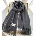 Deep grey cashmere-feel scarf with fringes and minimalist brand label on white background - Dark Gray