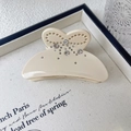 Elegant beige bow hair claw clip with sparkling rhinestones on acetate material - Beige