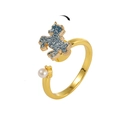 Close-up of rotating unicorn ring with blue glitter finish and white pearl detail - Unicorn Pearl