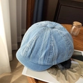 Close-up of light blue denim newsboy hat with vertical white stitching and retro texture - Light Blue Vertical Stripe