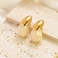Minimalist gold teardrop stud earrings with beige resin stone texture detail - White