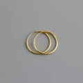 Detail view of smooth 925 silver hoop earrings with a minimalist golden polished finish - 18mm / Gold