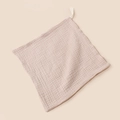 Macro shot of beige double-layer cotton gauze baby towel with convenient hanging loop - 23x23cm / Apricot Red