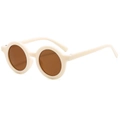 Close-up of retro round baby sunglasses with cream frame and UV400 brown lenses - Round / Beige