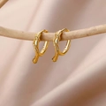 18k gold plated snake hoop earrings with detailed serpent texture on satin background - Gold Snake Wrap Hoop Earrings