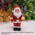 Christmas Santa Claus resin figurine holding a yellow star for miniature holiday decor - Santa Claus Ornament