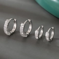 Luxury silver-tone huggie hoop earrings with micro-pave cubic zirconia set of four - Silver