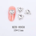 Detailed view of hollow heart nail charms with rhinestones and pink nail application - Silver Base Clear Heart Style (8958)