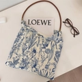 Detail view of floral print canvas tote with leather handle and snap button closure - Small Handbag (With Leather Handle)