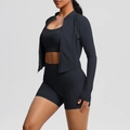 Side view of three-piece black yoga set with zipper jacket and high-waist shorts - S / Black