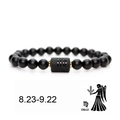 Detail view of Virgo zodiac black matte beaded bracelet with golden spacers and charm - Virgo
