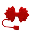 Detailed view of a red silicone bow straw topper for Stanley tumbler accessories - Red