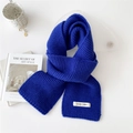 Soft thick knitted winter scarf in blue featuring a white label on a white table - Dark Blue