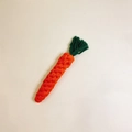 Close-up of durable cotton rope dog toy in a handmade carrot shape for teeth cleaning - Orange Green Carrot Knot
