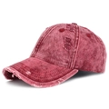 Close-up of distressed red denim baseball cap with vintage washed texture and ripped detail - Adjustable / Burgundy