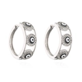 Macro shot of silver hoops with sparkling cubic zirconia inlaid evil eye designs - Silver Black & White Eye