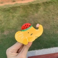 Detail of yellow elephant hair clip with watermelon pattern in polished acetate - Elephant with Watermelon