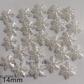 Macro view of 14mm snowflake-shaped faux pearl beads with a pearlescent resin finish - 14mm Snowflake (Center Hole)
