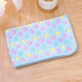 Detail of soft blue flannel pet blanket featuring colorful star patterns on wooden floor - Sky Blue Star Print