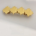 Matte gold leaf spring hair clip with unique vertical ribbed texture and metallic finish - Diamond Gold