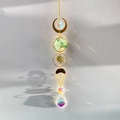 Macro detail of Tree of Life suncatcher with green crystals and rainbow light prisms - Aventurine Tree of Life
