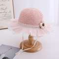 Detail of pink straw sun hat with pleated chiffon trim and adjustable chin strap - Pink
